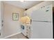 Bright kitchen with white cabinets and appliances at 850 S Tamiami Trl # 624, Sarasota, FL 34236
