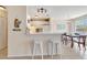 Bright kitchen features white cabinets, tile flooring and beach-themed decor at 850 S Tamiami Trl # 624, Sarasota, FL 34236