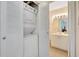 Convenient laundry room featuring a stacked washer and dryer, located near the bathroom at 850 S Tamiami Trl # 624, Sarasota, FL 34236