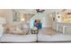 Spacious living room showcasing comfortable seating and staircase to upper level at 850 S Tamiami Trl # 624, Sarasota, FL 34236