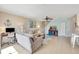 Comfortable living room with bright light, coastal decor, and staircase at 850 S Tamiami Trl # 624, Sarasota, FL 34236
