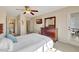 Comfortable bedroom featuring neutral colors and an ensuite bath at 850 S Tamiami Trl # 624, Sarasota, FL 34236