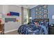 bedroom with blue race car themed bedding, and race car decor accents at 8579 Big Dipper Dr, Sarasota, FL 34241