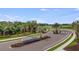 Community entrance with manicured landscaping and a modern Cassia at Skye Ranch sign at 8579 Big Dipper Dr, Sarasota, FL 34241