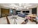 Recreation room with decorative wallpaper, game tables, comfortable seating, and large-screen televisions at 8579 Big Dipper Dr, Sarasota, FL 34241