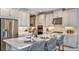 Bright kitchen featuring stainless steel appliances, a large island, and ample white cabinetry at 8579 Big Dipper Dr, Sarasota, FL 34241