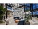Bright lobby with modern decor, comfortable seating, indoor plants, high ceilings, and a unique artistic wall at 8579 Big Dipper Dr, Sarasota, FL 34241