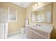Bright bathroom features a tub/shower combo and stylish vanity with modern fixtures at 9106 Yarberry St, Sarasota, FL 34240