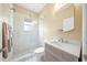 Bright bathroom features a glass enclosed shower and stylish vanity with modern fixtures at 9106 Yarberry St, Sarasota, FL 34240
