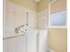 Bathroom features a walk-in tub, tiled walls, and grab bar at 9106 Yarberry St, Sarasota, FL 34240