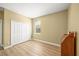 Bedroom features wood floor, one window, and closet at 9106 Yarberry St, Sarasota, FL 34240