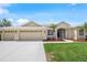 Well-maintained single-Gathering home with an extended driveway, three-car garage, vibrant landscaping, and inviting curb appeal at 9106 Yarberry St, Sarasota, FL 34240
