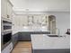 Elegant kitchen features granite countertops, stainless steel appliances, and stylish gray cabinetry at 9106 Yarberry St, Sarasota, FL 34240