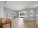 Bright living room featuring a sliding glass door and light wood-look floors at 9106 Yarberry St, Sarasota, FL 34240