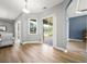 Bright living area with sliding doors and windows, view of back yard and access to other rooms at 9106 Yarberry St, Sarasota, FL 34240