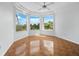Well-lit bedroom with tile flooring, neutral walls, and scenic views from multiple windows at 9315 9Th Nw Ave, Bradenton, FL 34209