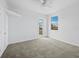 Bright bedroom with a large window, closet, and carpeted floor; offering a serene retreat at 9315 9Th Nw Ave, Bradenton, FL 34209