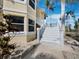 Close-up of the outdoor stairs, showcasing the home's detailed exterior and landscaping at 9315 9Th Nw Ave, Bradenton, FL 34209