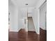 Spacious foyer with hardwood floors, staircase, and access to multiple rooms, creating an open feel at 9315 9Th Nw Ave, Bradenton, FL 34209