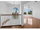 Bright foyer with a staircase, chandelier, and tile flooring leading to a spacious living area at 9315 9Th Nw Ave, Bradenton, FL 34209