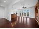 Open-concept living room with hardwood floors, ample natural light, and a seamless flow to the kitchen at 9315 9Th Nw Ave, Bradenton, FL 34209