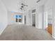 Expansive main bedroom with neutral carpet, balcony access, walk-in closet, and en-suite bathroom entrance at 9315 9Th Nw Ave, Bradenton, FL 34209
