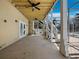 Large patio with stairs, white railing, ceiling fans, and outdoor access at 9315 9Th Nw Ave, Bradenton, FL 34209