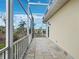 Cozy screened porch with tiled flooring and a peaceful view of the surrounding landscape at 9315 9Th Nw Ave, Bradenton, FL 34209