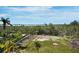 Large grassy yard with partial landscape and a water view at 9315 9Th Nw Ave, Bradenton, FL 34209