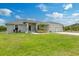 Charming single Gathering home featuring a well manicured lawn and a two car garage at 9601 Calumet Blvd, Port Charlotte, FL 33981