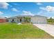 Charming single Gathering home featuring a well manicured lawn and a two car garage at 9601 Calumet Blvd, Port Charlotte, FL 33981