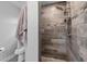 This remodeled shower with gray tiling and modern fixtures creates a spa-like experience for relaxation and rejuvenation at 9601 Calumet Blvd, Port Charlotte, FL 33981
