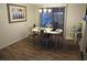 Cozy dining area with chandelier lighting and view of outdoor patio through sliding glass doors at 9835 El Camino Real Ave, Port Richey, FL 34668