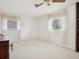 Bright bedroom featuring two large windows with decorative curtains at 1014 Contento St, Sarasota, FL 34242