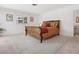 Bedroom with wood-accented furniture and a large area rug at 1014 Contento St, Sarasota, FL 34242