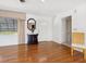 Inviting living room featuring hardwood floors, natural light, and neutral decor; ample seating available at 1014 Contento St, Sarasota, FL 34242