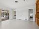 Open living area features white walls, sliding glass doors, and lots of space at 1014 Contento St, Sarasota, FL 34242
