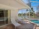 Beautiful covered patio area featuring lounge chairs and views of the canal at 1014 Contento St, Sarasota, FL 34242