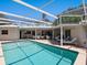 This backyard features a large pool and multiple seating areas for outdoor relaxation at 1014 Contento St, Sarasota, FL 34242