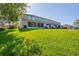 A long view of a building's lawn and patio area at 1033 Grantham Dr, Sarasota, FL 34234