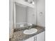 Bathroom featuring granite countertops, a sink, and vanity at 1033 Grantham Dr, Sarasota, FL 34234