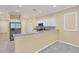 A beautifully designed kitchen with white cabinets, granite countertops, stainless steel appliances and tile flooring at 1033 Grantham Dr, Sarasota, FL 34234