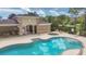 Community pool area with building, hot tub, tables and chairs for residents to enjoy at 1033 Grantham Dr, Sarasota, FL 34234