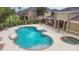 Community pool and hot tub area with tables and chairs for relaxing by the water at 1033 Grantham Dr, Sarasota, FL 34234