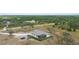 Lovely aerial view of this property backing up to a beautiful pond and serene landscaping at 1116 406Th E Ct, Myakka City, FL 34251