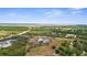 Wide aerial shot of a property surrounded by lush landscapes at 1116 406Th E Ct, Myakka City, FL 34251