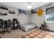 Eclectic bedroom with unique decor, wood-look flooring, and comfortable furnishings at 1116 406Th E Ct, Myakka City, FL 34251