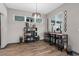 Contemporary dining area with modern decor, a sleek bar table, and natural light at 1116 406Th E Ct, Myakka City, FL 34251