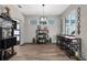 Stylish dining area featuring modern shelving, an elegant bar, and ample natural light at 1116 406Th E Ct, Myakka City, FL 34251