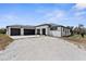 Contemporary home featuring a three-car garage and gravel driveway at 1116 406Th E Ct, Myakka City, FL 34251